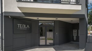 A modern building with a sign reading "TESLA RESIDENCE". - TESLA Residence Subotica (Subotica)