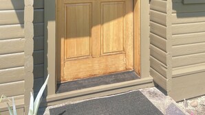 A wooden front door with a glass panel and a doormat. - Cozy Rattlesnake Creekside Cabin Retreat  (Missoula)