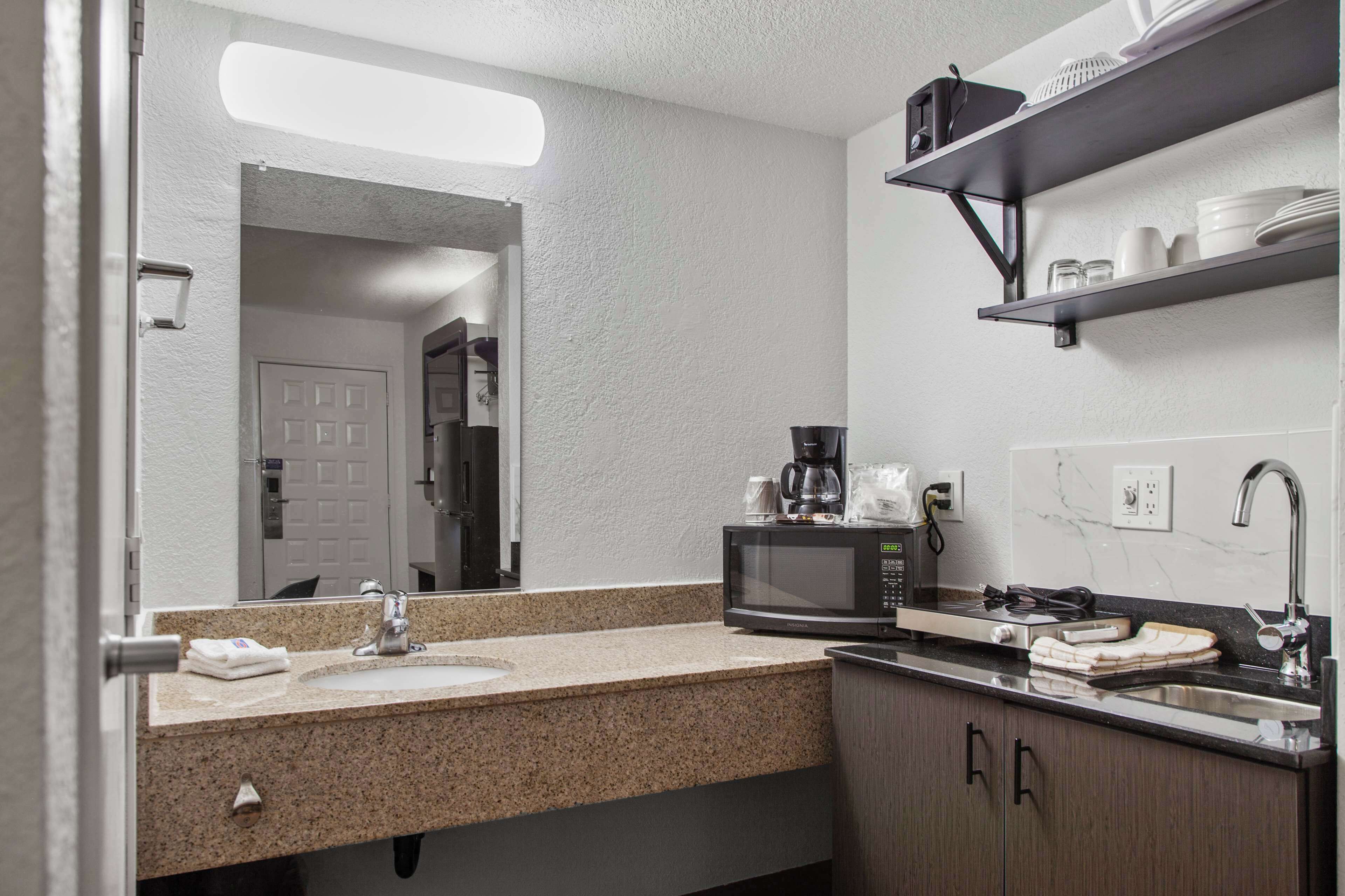 Full-sized fridge, microwave, stovetop, coffee/tea maker