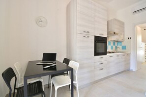Dining - Two-room villa of approximately 40 m2 with small garden consisting of a double bedroom with double sofa bed and equipped kitchenette with oven, bathroom with shower, loggia equipped for outdoor dining. Sat TV, wi fi line and air conditioning (Costa Rei)
