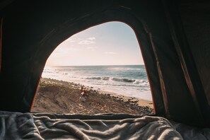 A tent with a view of a beach and ocean. - Fully Decked Lifted 4WD Black FJ Cruiser! (Kapaʻa)