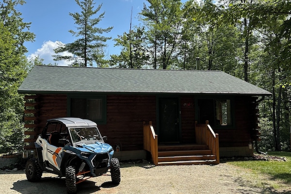 Our lovely cabin with the UTV.