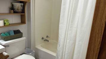 Shower, towels, soap, toilet paper