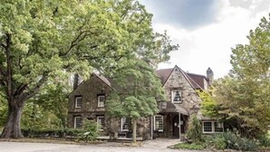 A stone building with a traditional architectural style, featuring a central entrance and multiple windows. - The Cabin in Tracy City (Tracy City)