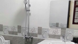A bathroom with a shower, a sink, and a toilet. - Anh Trang Hostel LS - by BAY LUXURY (Tam Thanh)