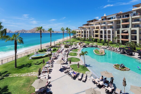 A resort with a pool, beach, and ocean views.