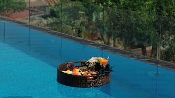 Outdoor pool, open 6:00 AM to 5:00 PM, pool umbrellas, pool loungers