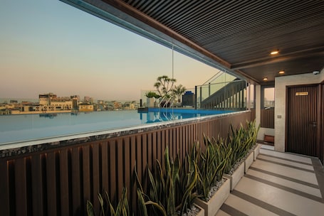 Outdoor pool, open 6:00 AM to 5:00 PM, pool umbrellas, sun loungers