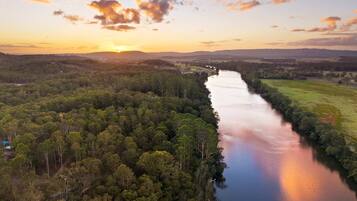 A river winding through a densely forested area with a clear view of the surrounding landscape.