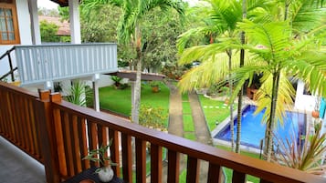 Deluxe Triple Room, Balcony, Pool View | Terrace/patio