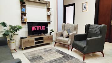 Superior Apartment, City View | Living area | 43-inch Smart TV with cable channels, Netflix, Hulu