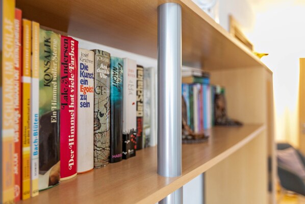 A bookshelf with various books.