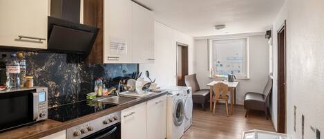 Fridge, microwave, stovetop, coffee/tea maker