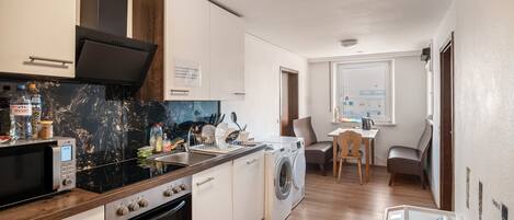 Fridge, microwave, stovetop, coffee/tea maker