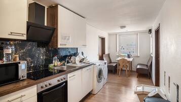 Fridge, microwave, stovetop, coffee/tea maker