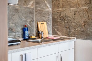 Fridge, microwave, stovetop, coffee/tea maker