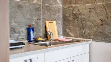 Fridge, microwave, stovetop, coffee/tea maker