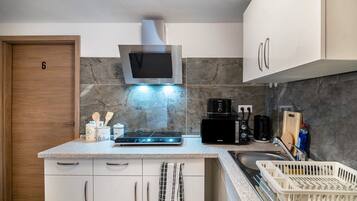 Fridge, microwave, stovetop, coffee/tea maker