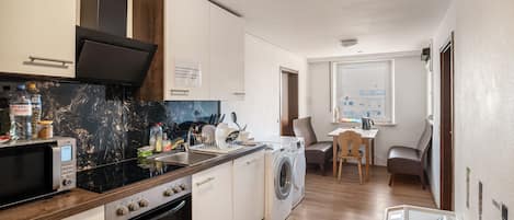 Fridge, microwave, stovetop, coffee/tea maker