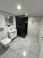 Luxury Studio Suite | Bathroom | Slippers