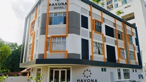 A modern multi-story hotel named HAVONA HOTEL with a clean, contemporary design featuring white walls and orange accents. - Havona Hotel @ CIQ Johor Bahru - Self Check-In (Johor Bahru)