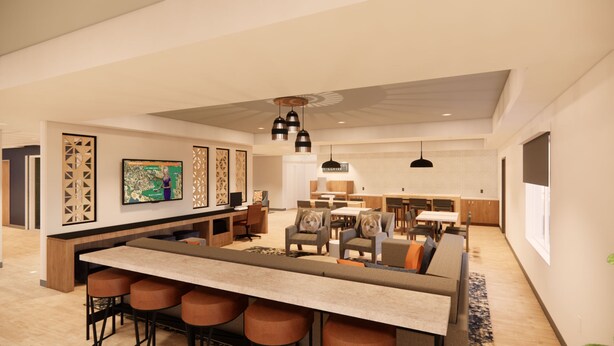 Un intérieur moderne comprenant un bar, des espaces pour s’asseoir et une cuisine.