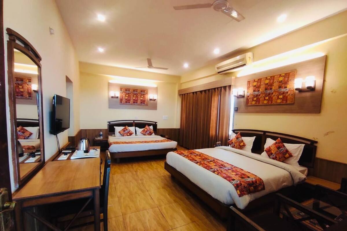 Family Suite, Balcony, City View | 1 bedroom, desk, laptop workspace, iron/ironing board