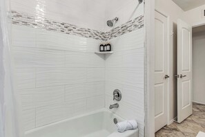 Shower, hair dryer, towels, shampoo