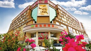 A hotel with a prominent entrance, large windows, and a sign indicating it is a hotel. - Vienna hotel shenzhen shajing shangnan  (Shenzhen)