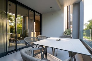 Enjoy meals with family and friends at the large dining table surrounded by six comfortable chairs.