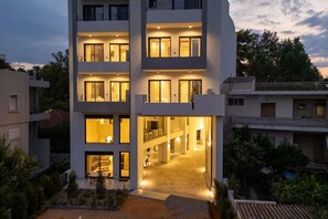 Stunning multi-story building with a central courtyard and covered entrance.