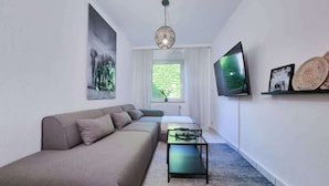 Unclassified image, 5 of 12, button - Alpha Apartments: Central 2BR, Living Room & Bath (Essen)