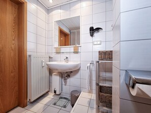 Shower, hair dryer, towels, toilet paper