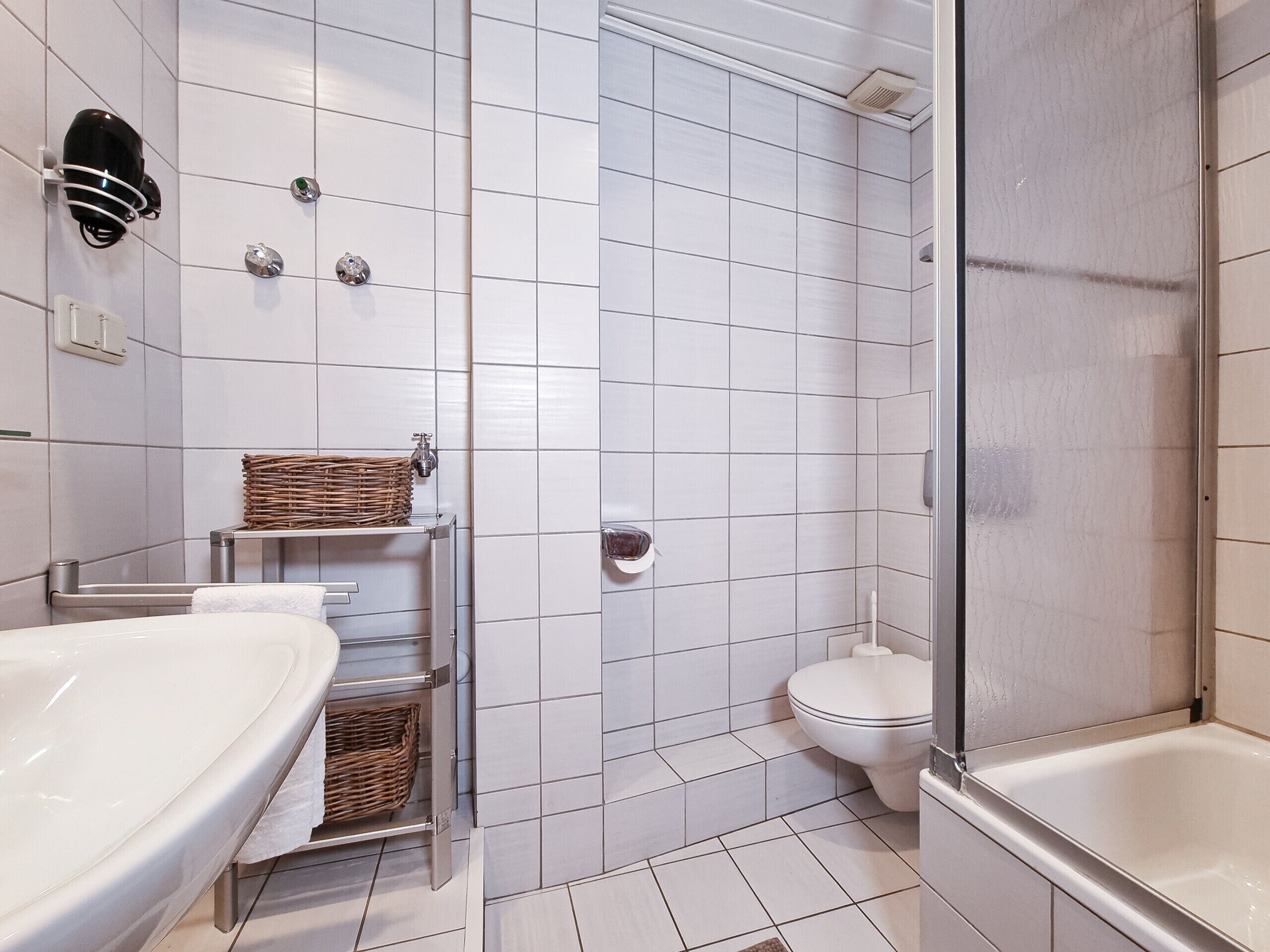 Shower, hair dryer, towels, toilet paper