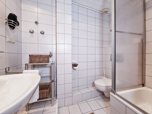 Shower, hair dryer, towels, toilet paper