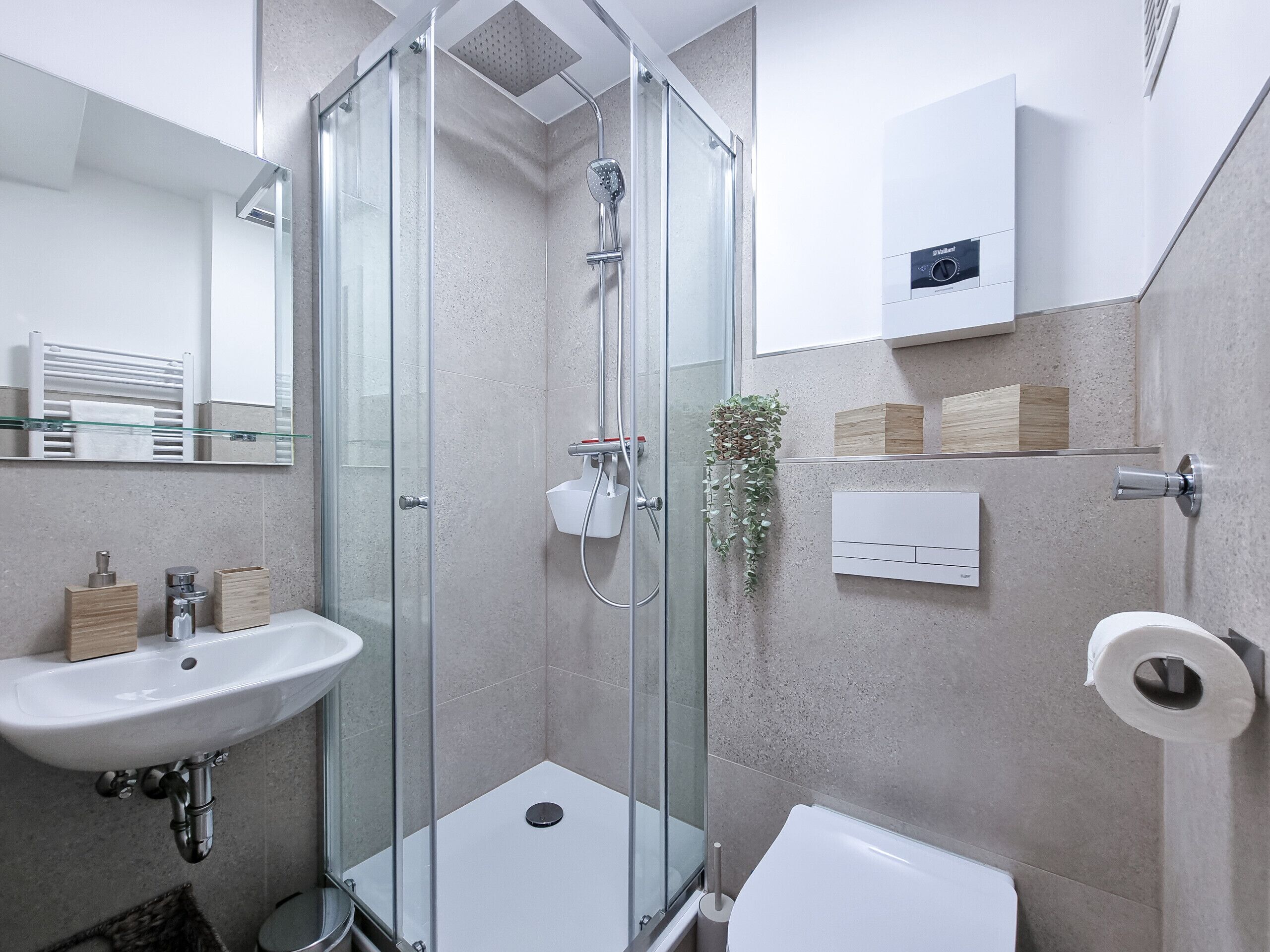 Shower, hair dryer, towels, toilet paper