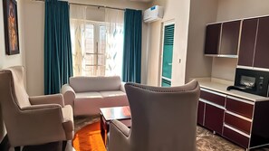 Family Apartment, Pool View | Down duvets, in-room safe, individually furnished, desk
