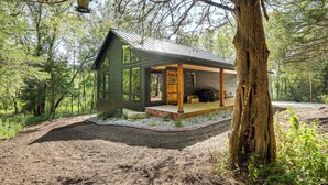A rustic cabin with a porch, surrounded by trees. - Galena Cabin on 20 Acres: 5 Mi to Downtown! (Galena)