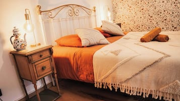 1 bedroom, desk, iron/ironing board, travel crib