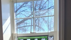 A window with a stained glass design featuring carrots.