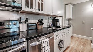 Coffee/tea maker, fridge, microwave, oven
