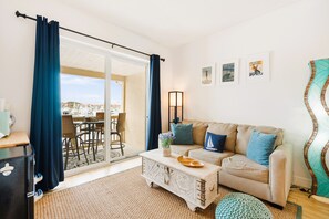 Standard Studio, Balcony, Harbour View | Living area | 40-inch TV with cable channels