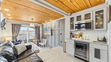 Standard Studio, Balcony, Harbor View | Living area | 40-inch TV with cable channels