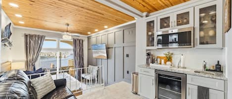 Standard Studio, Balcony, Harbor View | Living area | 40-inch TV with cable channels