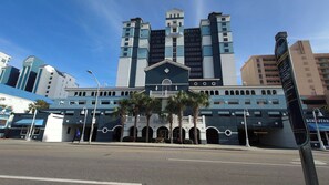 A hotel with a central entrance, multiple floors, and a distinctive tower-like structure.