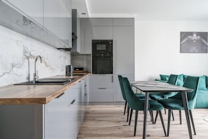 Family Apartment, 2 Bedrooms, Balcony, Tower | Private kitchen | Fridge, microwave, stovetop, dishwasher