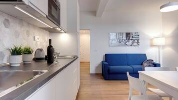 Apartment, 2 Bedrooms | Living area | 24-inch flat-screen TV with digital channels