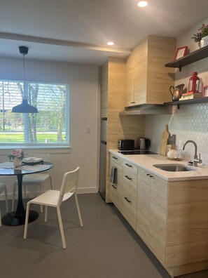 Microwave, toaster, cookware/dishes/utensils, dining tables