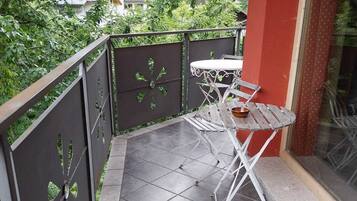 Quadruple Room, Balcony, Mountain View | In-room dining