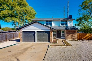 Exterior - Modern home with an enclosed backyard with wood fire pit in North Austin (Austin)